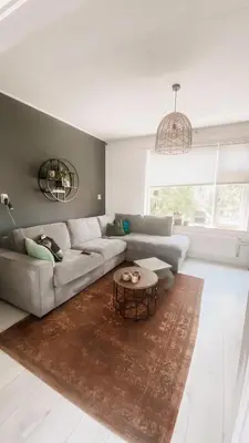 a living room with a couch and a table at Charming Entire Home Near Amsterdam in Hilversum