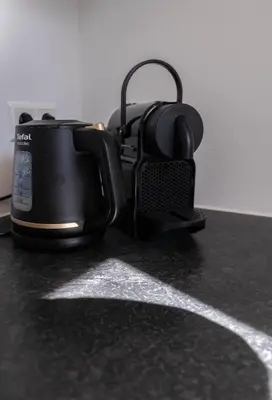 a coffee pot and headphones sitting on a counter at Zeemeeuw in Egmond aan den Hoef
