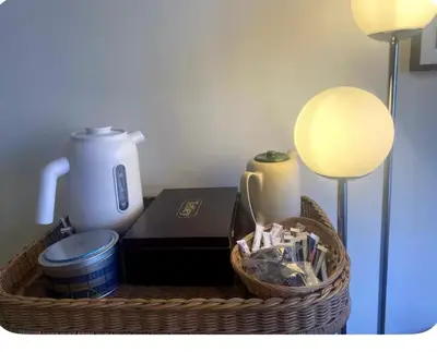 a basket with a lamp and a book and a blender at charming studio in Amsterdam-Noord in Amsterdam