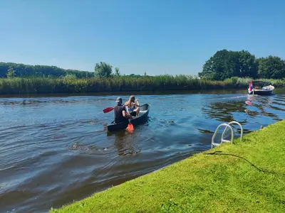a group of people in kayaks on a river at Park De Driesprong in Nieuwveen