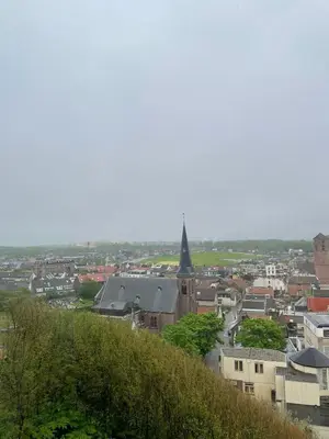 a view of a city from a hill with a church at Beachhouse Wijk aan Zee! in Wijk aan Zee