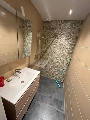 a bathroom with a sink and a shower at Close to the beach modern appartement Oranje Boven in Zandvoort