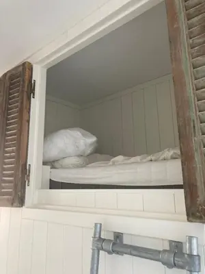 a mirror in a room with two bunk beds at Close to the beach modern appartement Oranje Boven in Zandvoort