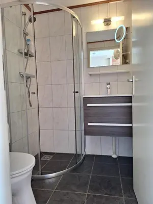 a bathroom with a shower and a toilet at Rekerlanden 210 in Schoorldam