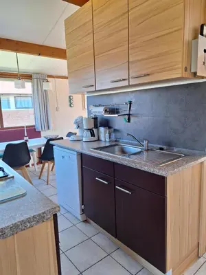 a kitchen with a sink and a counter top at Rekerlanden 210 in Schoorldam