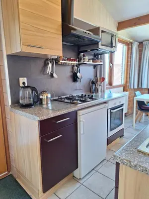 a kitchen with a stove and a counter top at Rekerlanden 210 in Schoorldam