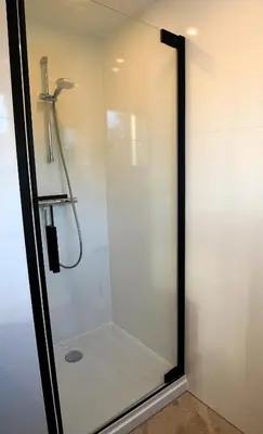 a shower with a glass door in a bathroom at De Sas in Lisse in Lisse