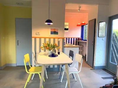 a dining room with a table and chairs at Holiday Home in Noordwijkerhout near Lake in Noordwijkerhout