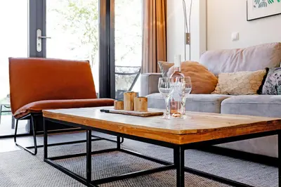 a living room with a coffee table and a couch at Villa Koperwiek in Egmond aan den Hoef
