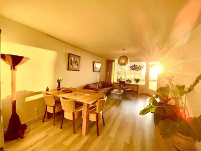 a living room with a dining room table and a couch at Sterflat 33 - 
