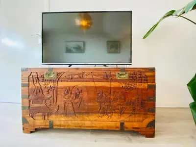 a wooden dresser with a mirror on top of it at Sterflat 33 - 