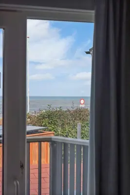 a view of the ocean from a window at Coastal Inn in Zandvoort