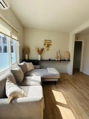 a living room with a couch and a table at Willem's Beachhouse in Noordwijk