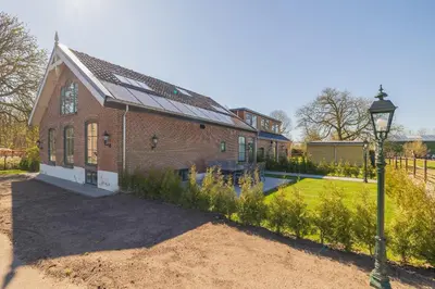 a brick building with a street light in front of it at Villa Meer en Duin in Noordwijkerhout