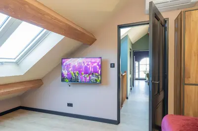 a hallway in a house with skylights at Villa Meer en Duin in Noordwijkerhout