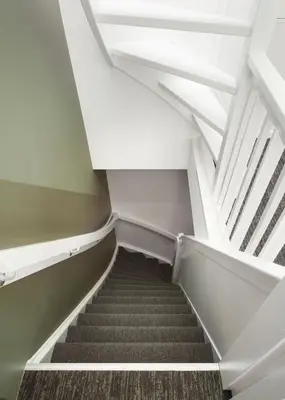 a staircase in an office building with a white ceiling at Limehome Utrecht Balijelaan in Utrecht