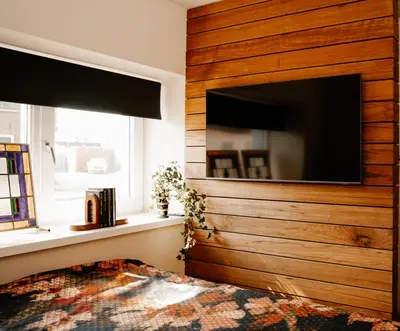 a living room with a large flat screen tv at de Bunker Katwijk in Katwijk
