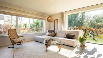 a living room with a couch and a table at Villa Endless Summer in Bergen