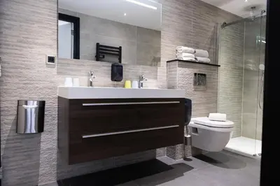 a bathroom with a sink and a toilet at La Casita bed and breakfast in Voorschoten