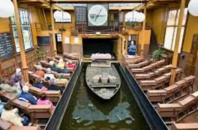 a group of people on a boat in a canal at Huisje Suus, inclusief jacuzzi, kano en kajak in Zuid-Scharwoude