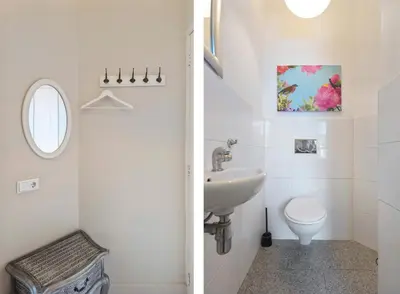 a white bathroom with a sink and a toilet at De Sonnehoeck Zandvoort in Zandvoort