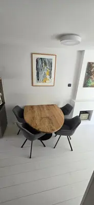 a table and two chairs in a room at Centrally located, fully furnished luxury apartment in Gouda