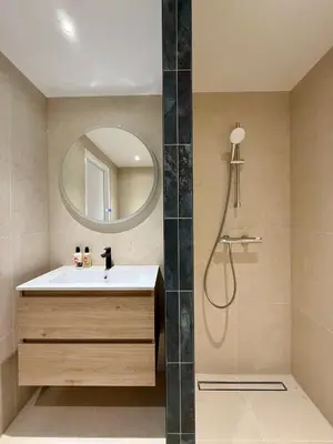 a bathroom with a sink and a mirror at Sunset Beach in Zandvoort