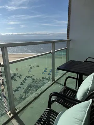 a balcony with a view of the beach and the ocean at Sunset Beach in Zandvoort