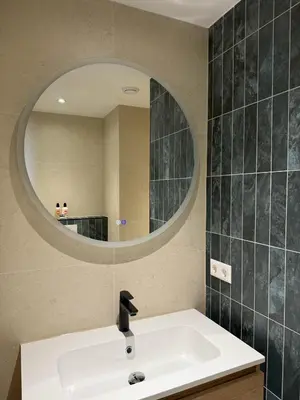 a bathroom with a sink and a mirror at Sunset Beach in Zandvoort