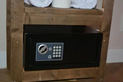 a microwave oven sitting on top of a wooden shelf at The IF Boutique hotel in Amsterdam