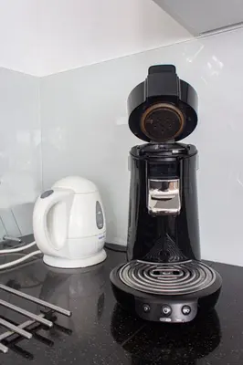 a coffee maker sitting on top of a counter at Lovely cozy houseboat Rembrandt, old centre Leiden in Leiden