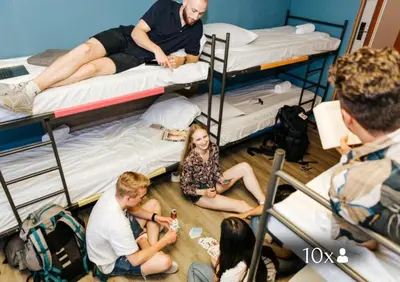 a group of people in a room with bunk beds at Amsterdam Teleport Hotel - Free Parking in Amsterdam