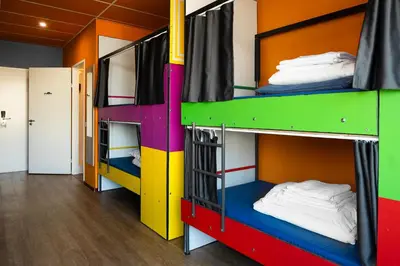 a group of bunk beds in a room at Amsterdam Teleport Hotel - Free Parking in Amsterdam
