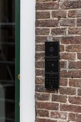 a brick wall with a black electrical box on it at De Kroonkamer in Loenen aan de Vecht