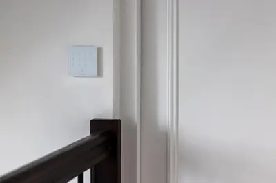 a clock on a wall next to a door at De Buitenplaats in Loenen aan de Vecht
