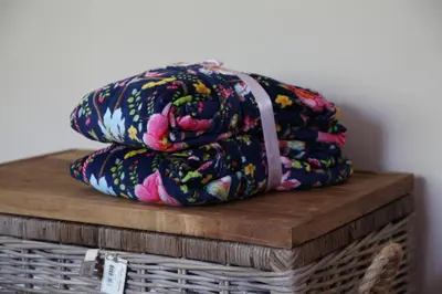 a pile of blankets sitting on top of a basket at Bubbles & Bed in Bilthoven
