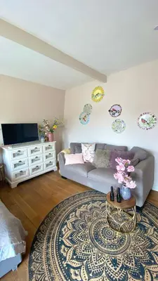a living room with a couch and a table at Bubbles & Bed in Bilthoven
