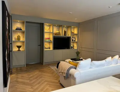 a living room with a white couch and a television at Luxurious, spacious appartment in Amsterdam
