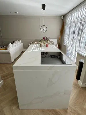a kitchen with a large white island in a room at Luxurious, spacious appartment in Amsterdam