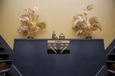 a computer screen with two potted plants on top of it at Manzo's Suites in Zaandam