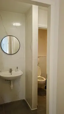 a bathroom with a sink and a toilet at Y Hostel in Amsterdam