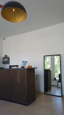 a room with a counter and a large light fixture at Y Hostel in Amsterdam
