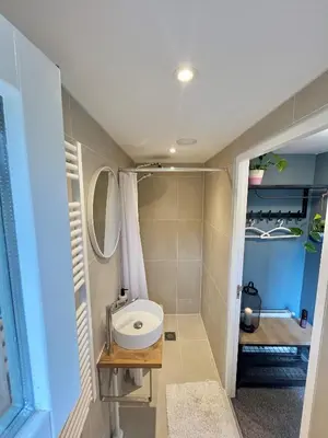 a bathroom with a sink and a toilet at Bed and Breakfast Verlaat in Oude-Niedorp