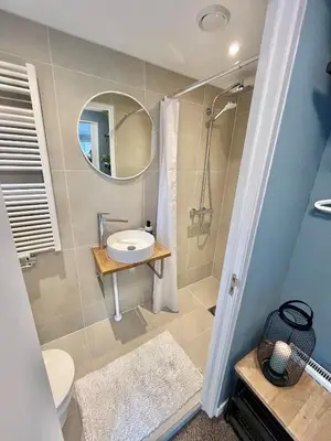 a bathroom with a sink and a mirror at Bed and Breakfast Verlaat in Oude-Niedorp
