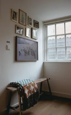 a living room with a bench and a window at B&B La Balena in Zaandijk near Amsterdam in Zaandijk
