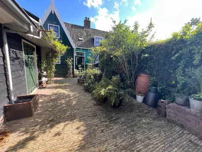 a house with plants on the side of it at B&B La Balena in Zaandijk near Amsterdam in Zaandijk
