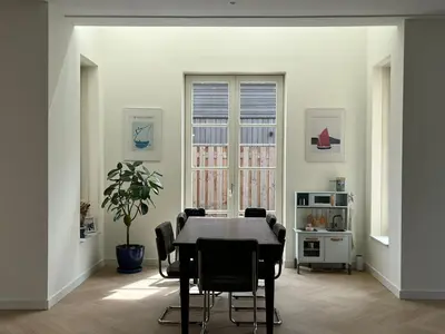 a dining room with a table and chairs at House with garden in Amsterdam in Weesp