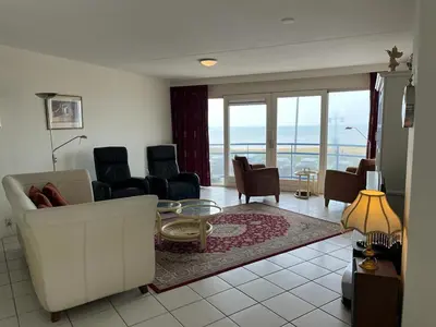 a living room with a couch and chairs at Atlantis 14a in Egmond aan Zee