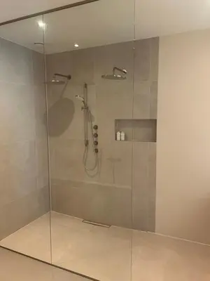a shower with a glass door in a bathroom at Spacious and lovely home in Amsterdam