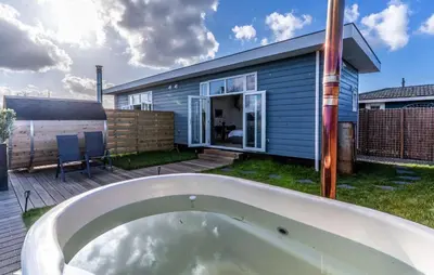 a bath tub in the backyard of a house at Beautiful Home In Vinkeveen With Sauna in Vinkeveen